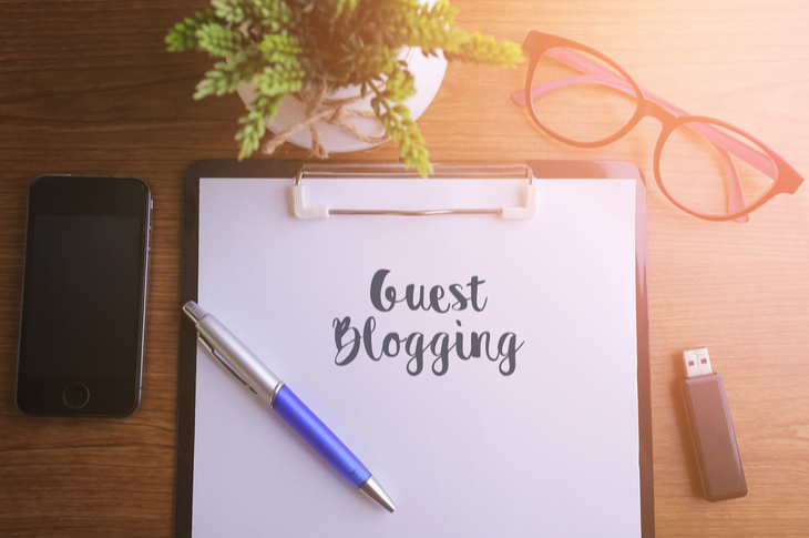 guest post - a notepad on a workplace saying "Guest Blogging"