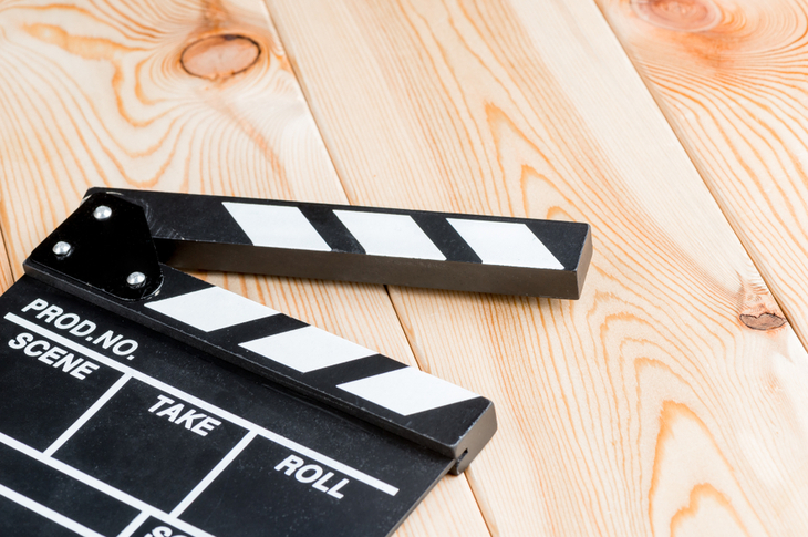 video types - a clapperboard placed on a wooden surface