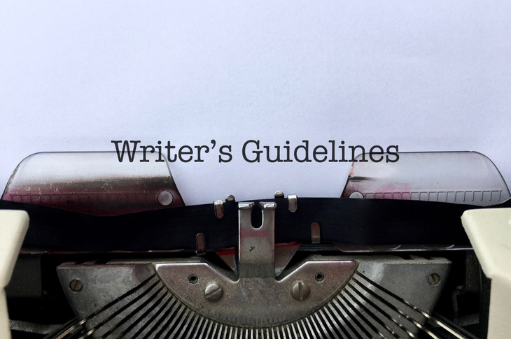 style sheet - Writer’s Guidelines, title heading typewritten on paper on vintage manual typewriter machine