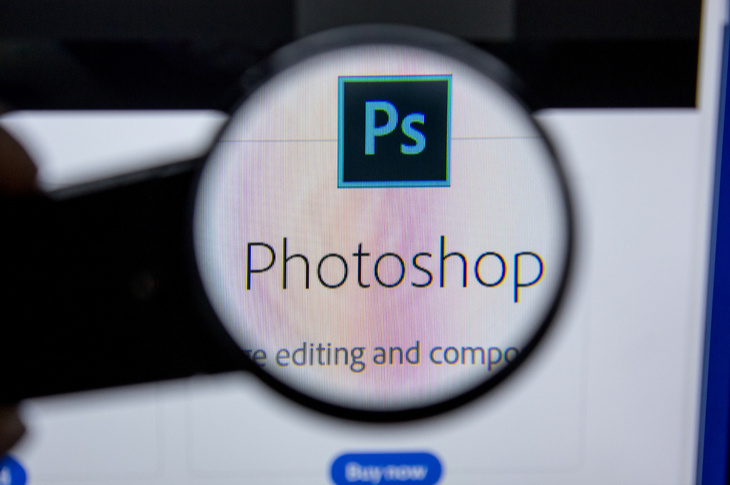 using magnifying glass on the word photoshop in a screen