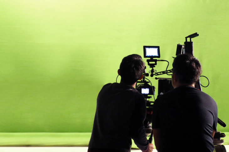 video creation - cameramen working in front of a green screen