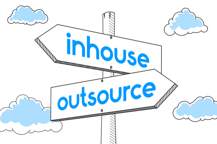 external content agencies - a signpost saying inhouse and outsource as two paths - Scatter