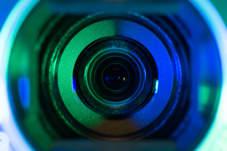 blue-green camera lens indicating livestreaming