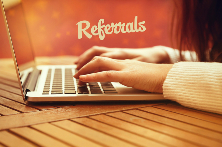 Customer referrals : Art of gaining referrals. A lady is using her laptop for the same.